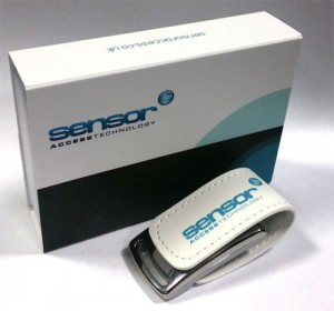 Image of the new Sensor Access USB key next to its packaging