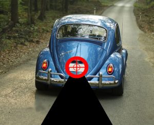 Image of a blue car with a target imposed on the number plate - demonstrating the process of License Plate Number Recognition (LPNR)